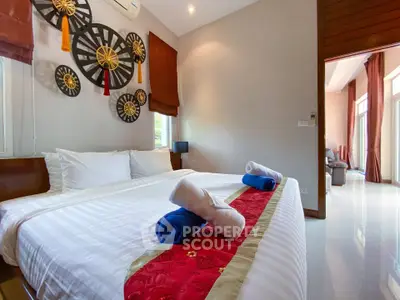 Luxurious bedroom with elegant decor and plush bedding in a modern home