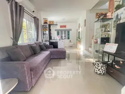 Spacious living room with modern decor and natural light