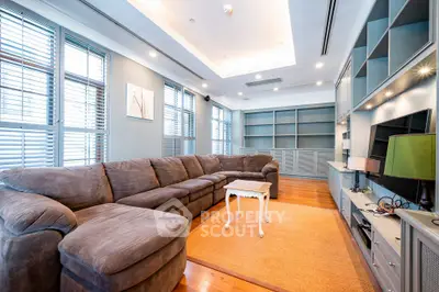 Spacious living room with cozy sectional sofa and modern built-in shelving