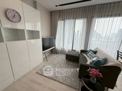 Modern living room with city view, stylish furniture, and natural light.