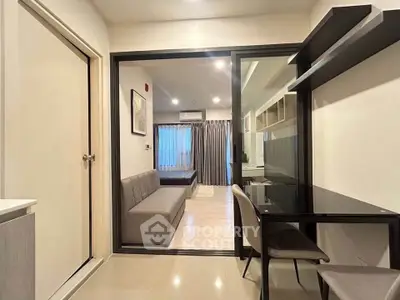 Modern apartment interior with glass partition and stylish furniture