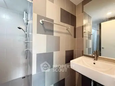 Modern bathroom with sleek tiles and contemporary fixtures