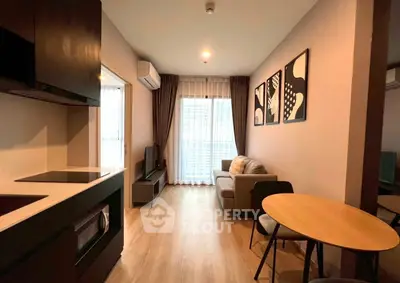 Modern living room with cozy sofa and stylish decor in open layout apartment.