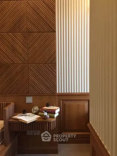 Elegant wooden interior with textured walls and cozy reading nook
