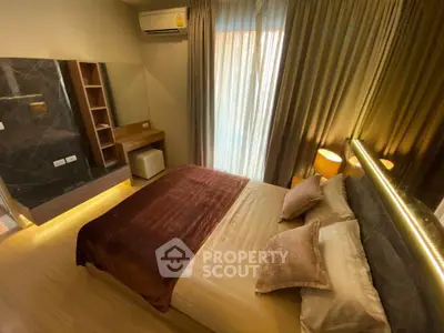 Luxurious bedroom with elegant decor and ambient lighting in modern apartment.