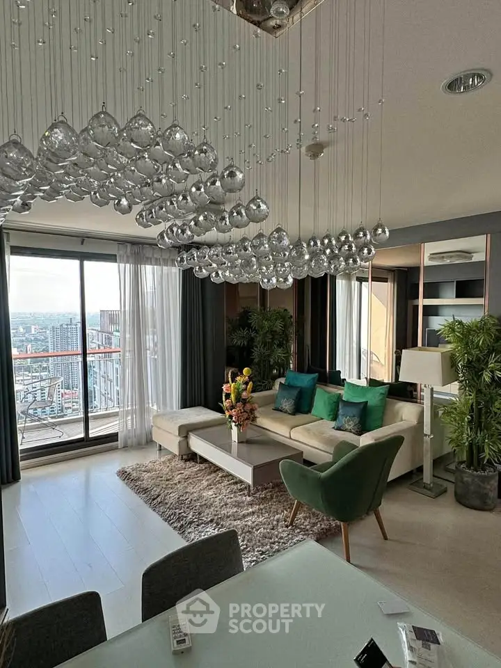 Luxurious living room with stunning city view and elegant chandelier