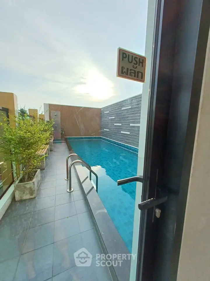 Luxurious rooftop pool with modern design and serene ambiance, perfect for relaxation and leisure.