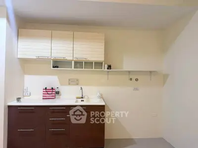 Modern kitchen with sleek cabinets and open shelving