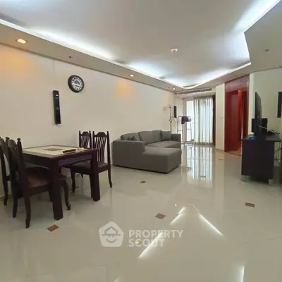 Spacious living room with modern furniture and elegant lighting