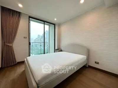 Spacious bedroom with city view and elegant decor in modern apartment
