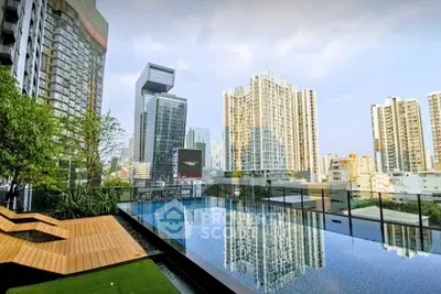 Luxurious rooftop pool with stunning city skyline views in a modern urban setting.