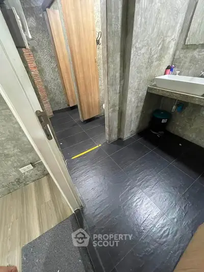 Modern bathroom with sleek design and stylish fixtures, featuring a spacious layout and contemporary finishes.