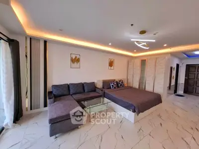 Spacious modern living room with stylish decor and elegant lighting