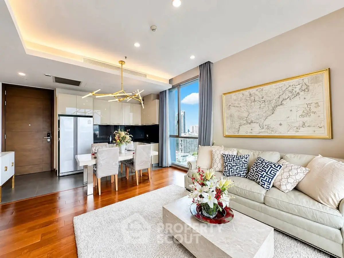 Luxurious living room with city view, elegant decor, and modern kitchen in high-rise apartment.