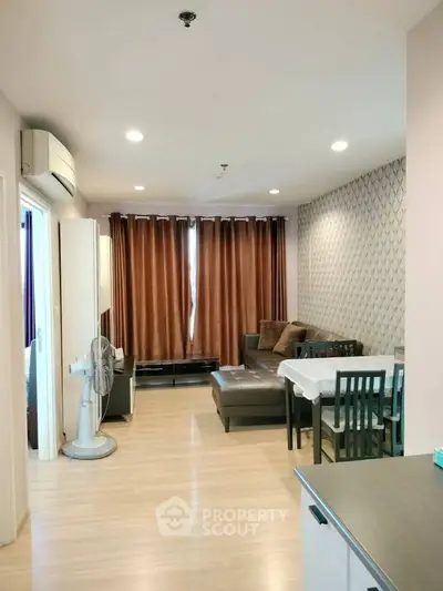 Spacious living room with modern decor and natural light