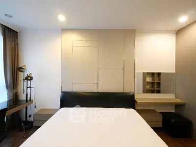 Modern bedroom with stylish decor and ample natural light