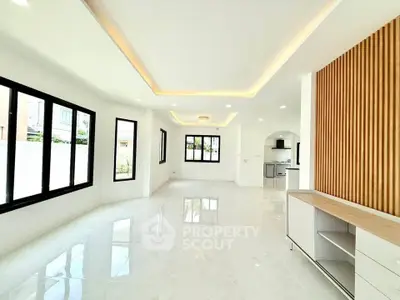 Spacious modern living room with open layout and elegant lighting