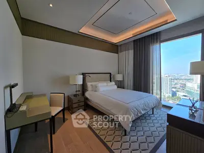 Luxurious bedroom with stunning city view and elegant decor