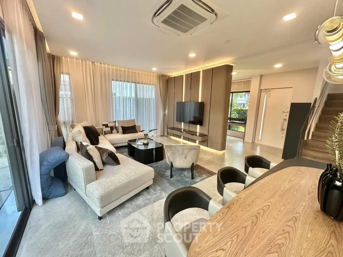 Luxurious modern living room with elegant decor and spacious seating area, perfect for relaxation and entertainment.