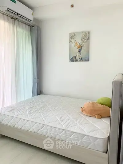 Cozy bedroom with natural light and minimalist decor