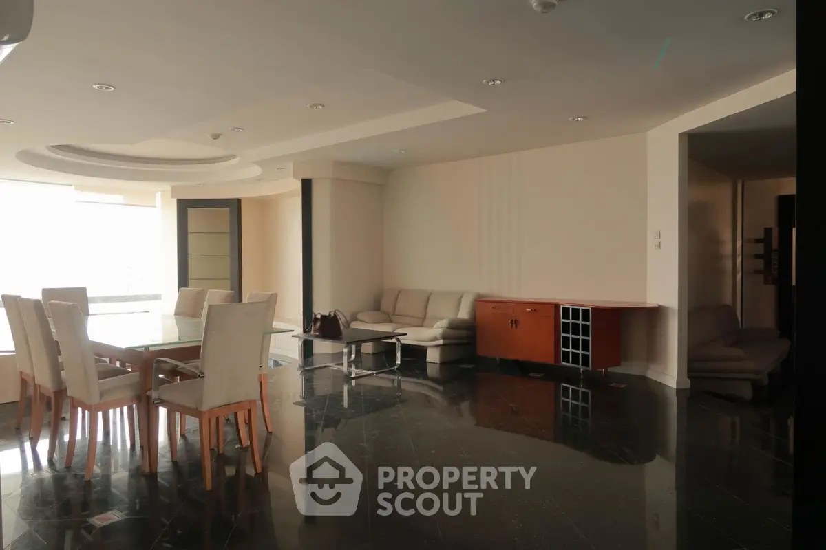 Spacious living room with elegant dining area and modern furniture