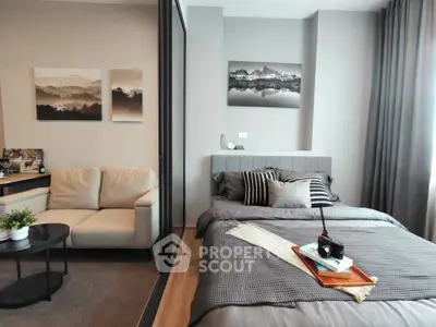 Modern bedroom with cozy seating area and stylish decor