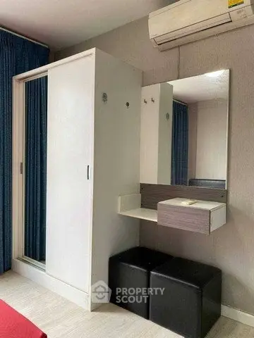 Modern bedroom with sleek wardrobe and vanity area