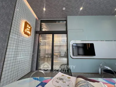 Modern interior with stylish decor and wall-mounted TV in a chic living space.