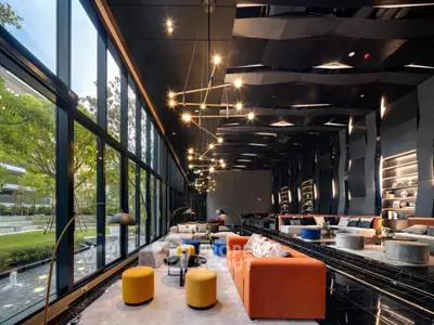 Luxurious modern living room with floor-to-ceiling windows and stylish decor