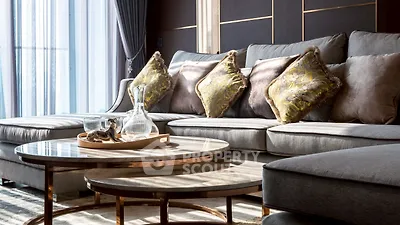 Luxurious living room with elegant sofa and stylish coffee table in natural light.