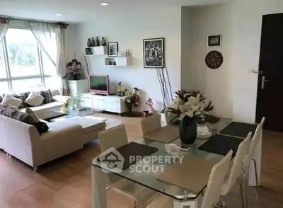 Spacious modern living room with elegant dining area and natural light