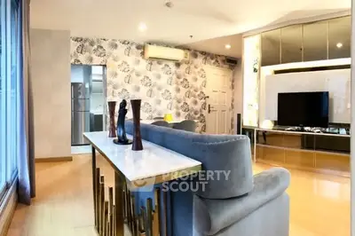 Stylish living room with modern decor and large windows in a contemporary apartment.