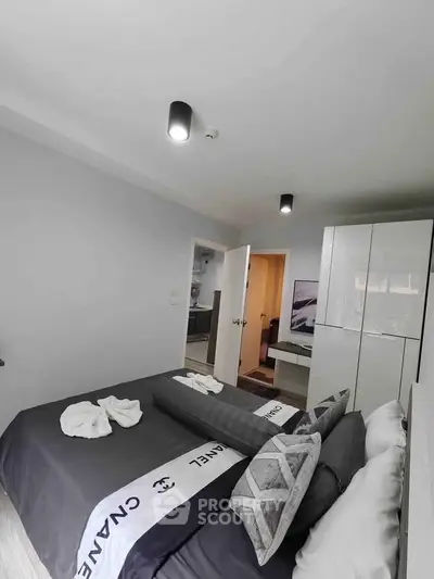 Modern bedroom with stylish decor and ample storage space