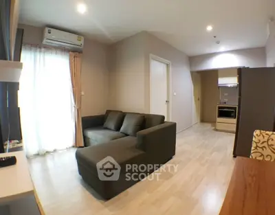 Modern living room with sleek furniture and open layout in a stylish apartment.