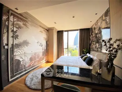 Luxurious bedroom with stunning wall art and large window offering a scenic view, perfect for modern living.