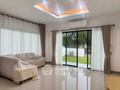 Spacious living room with modern design and garden view