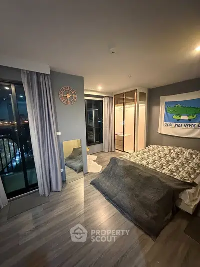 Modern bedroom with balcony view and stylish decor in urban apartment