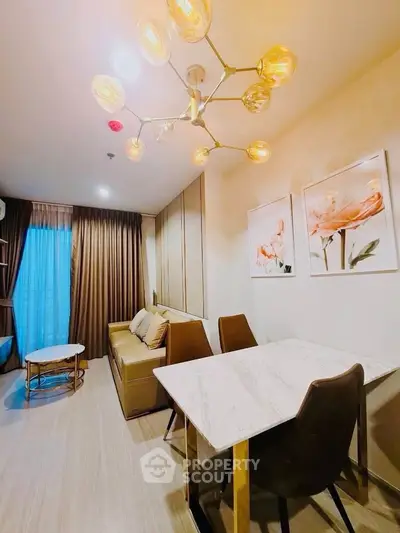 Modern living room with elegant lighting and stylish decor in a cozy apartment setting.