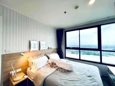 Cozy bedroom with stunning river view and modern decor