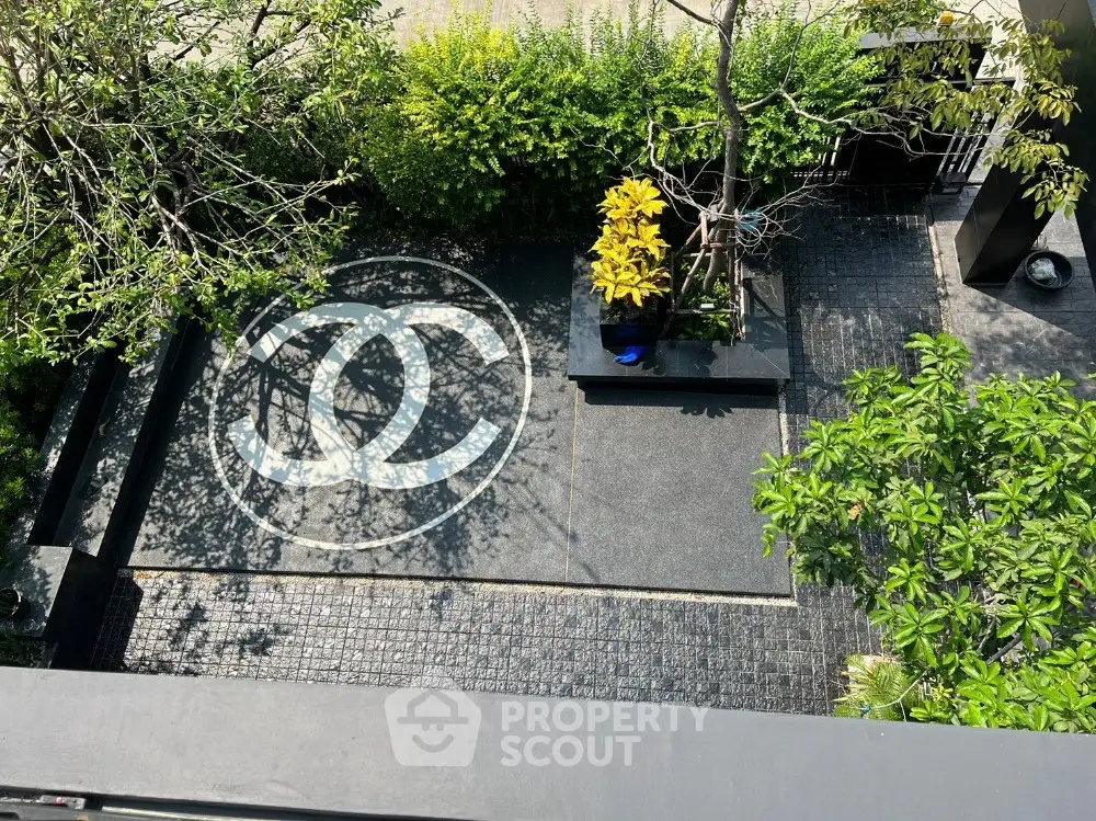 Luxurious garden view with elegant stone pathway and lush greenery, perfect for serene outdoor living.