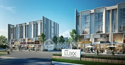 Modern commercial complex with sleek architecture and outdoor seating in vibrant urban setting.