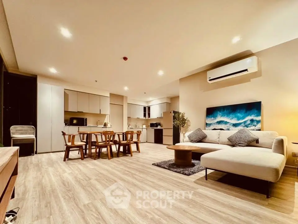 Spacious modern living room with open kitchen and stylish decor