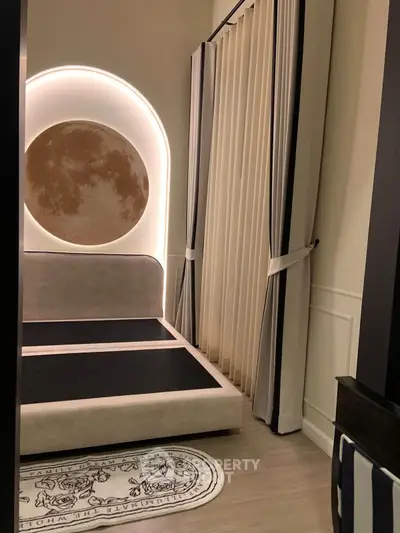 Luxurious modern bedroom with unique moon-themed decor and elegant lighting.
