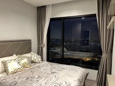 Luxurious bedroom with stunning night city view and elegant decor