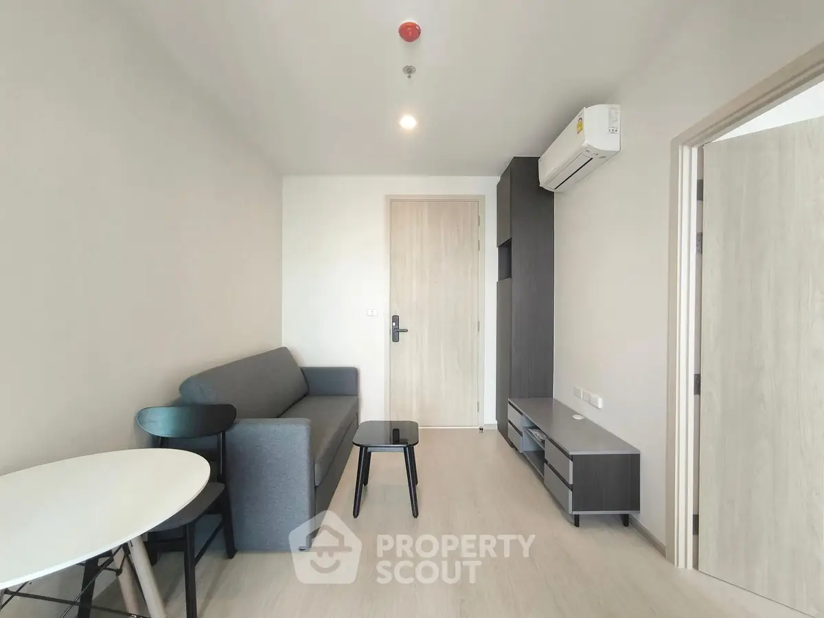 Modern living room with minimalist furniture and air conditioning