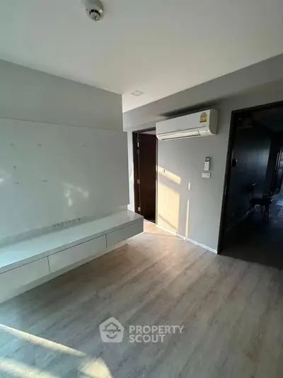 Modern interior with air conditioning and sleek flooring, perfect for comfortable living.