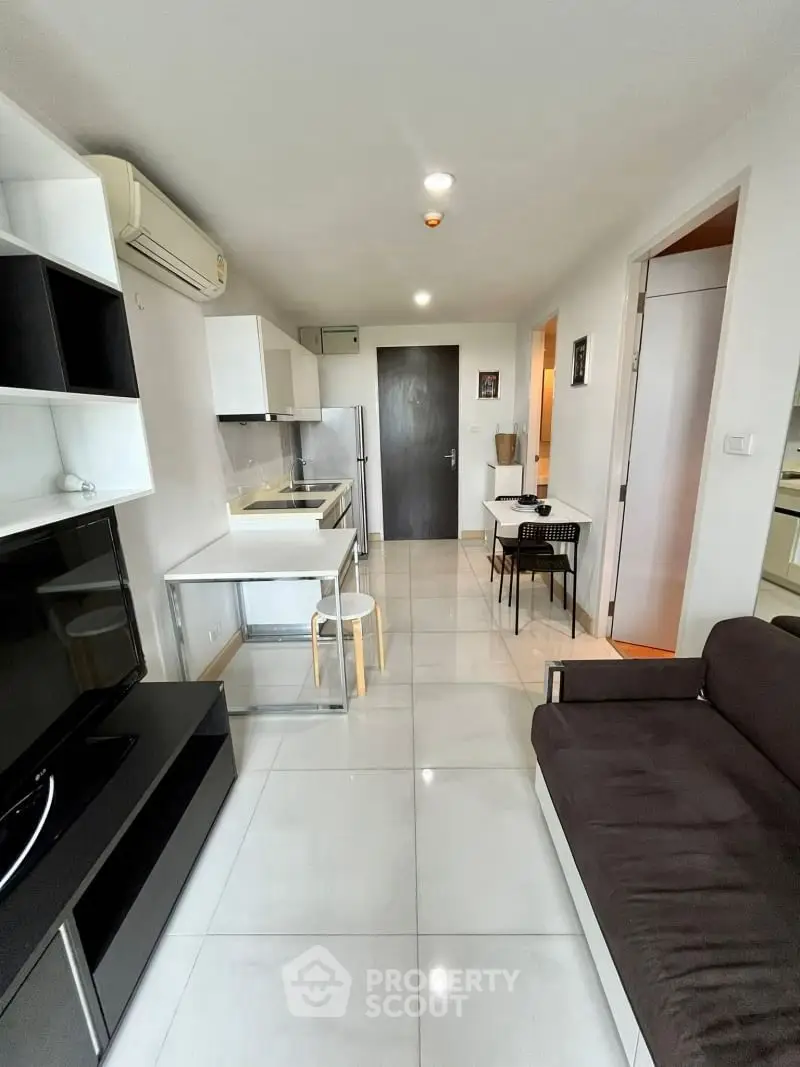 Modern apartment interior with sleek kitchen and cozy living area