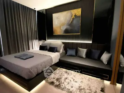 Luxurious bedroom with modern decor, plush bedding, and ambient lighting.