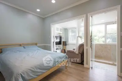 Spacious bedroom with ensuite bathroom and natural light