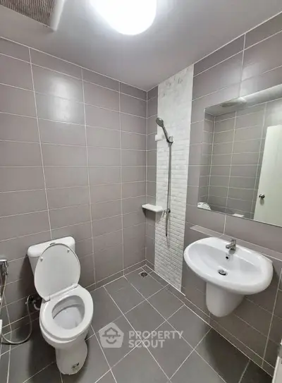 Modern bathroom with sleek tiles and contemporary fixtures